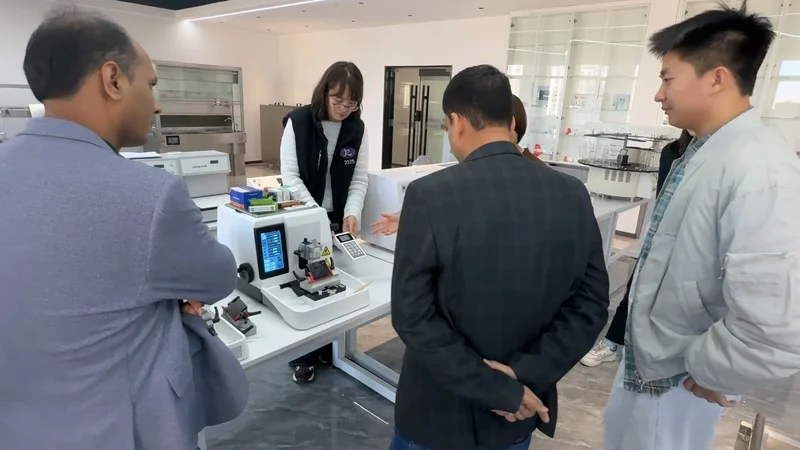 Customer reviewing autopsy table and pathology equipment in Roundfin showroom
